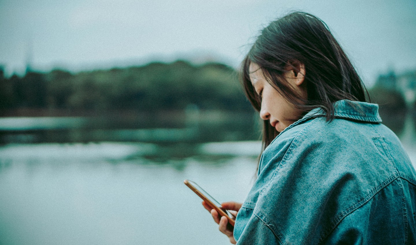 Person studying on their phone outdoors