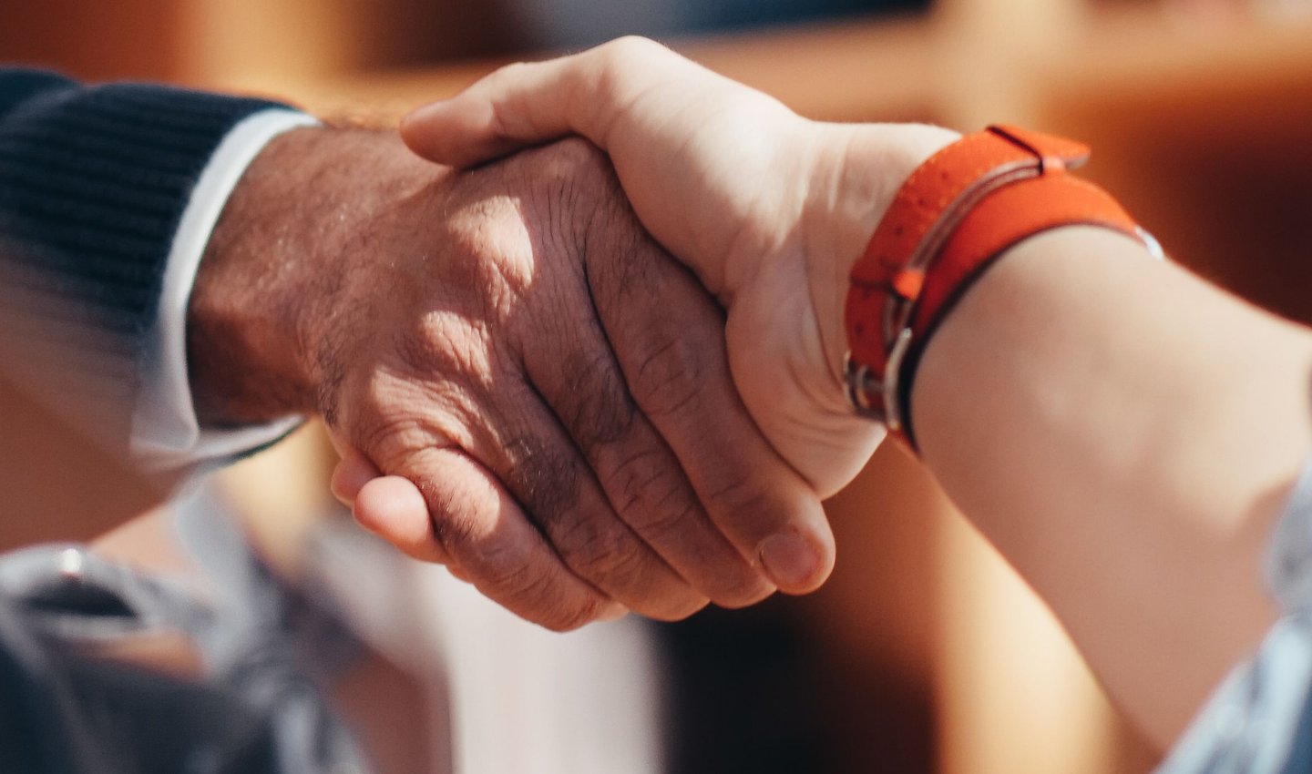A handshake, representing Socket's pass guarantee commitment